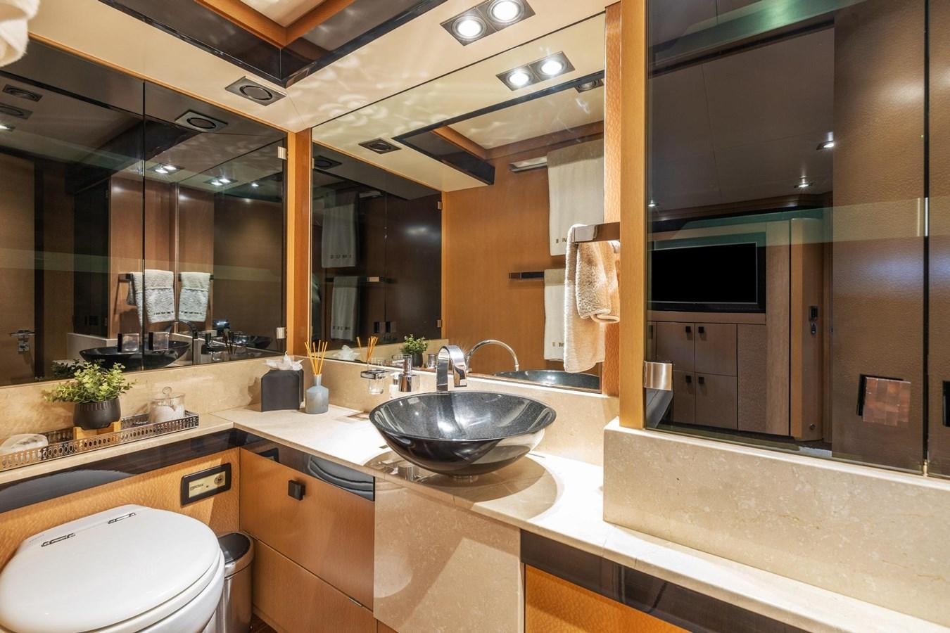 a bathroom with a large mirror aboard IZUMI Yacht for Sale
