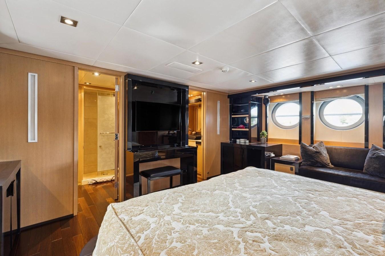 a large bed in a room aboard IZUMI Yacht for Sale