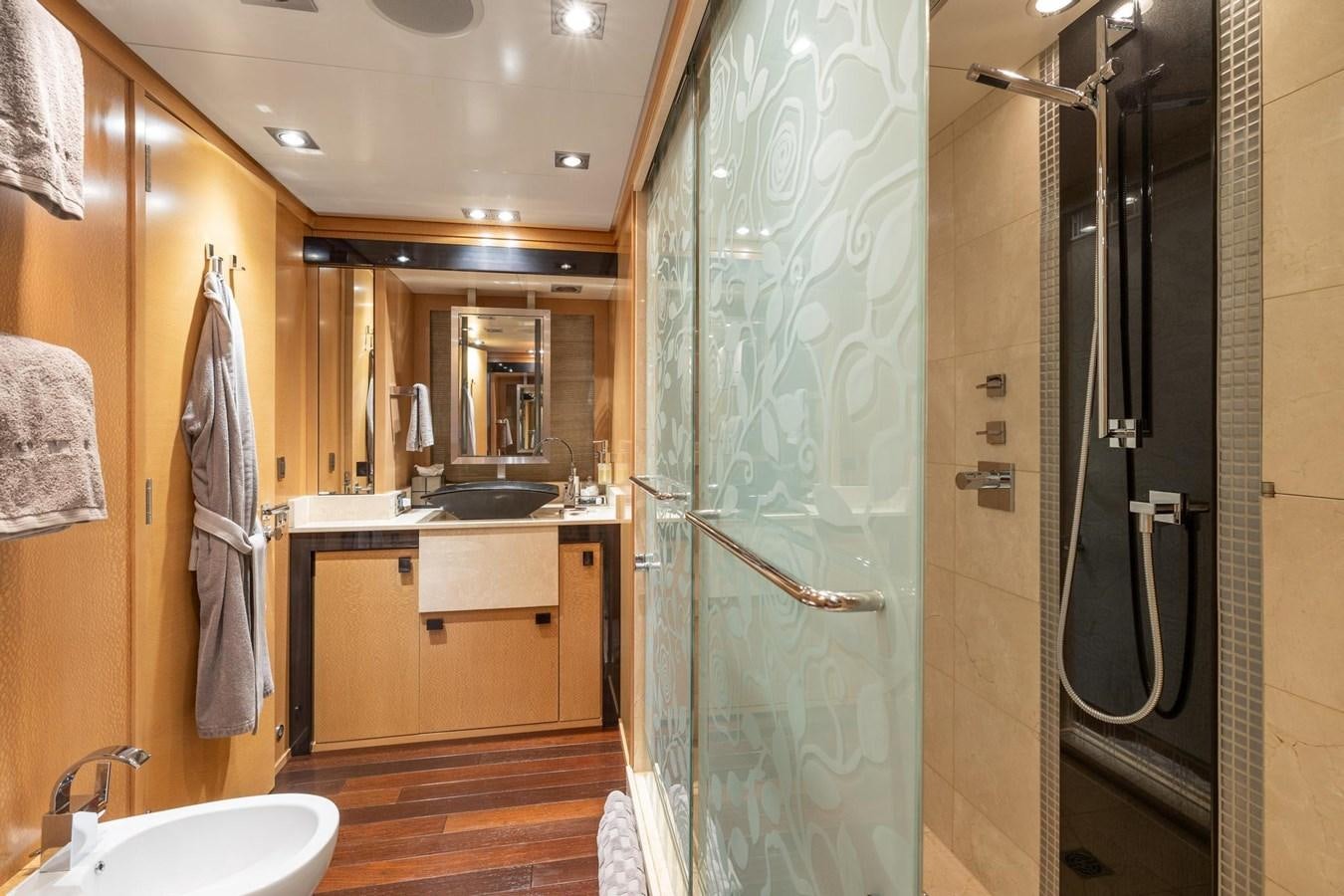a bathroom with a shower and sink aboard IZUMI Yacht for Sale