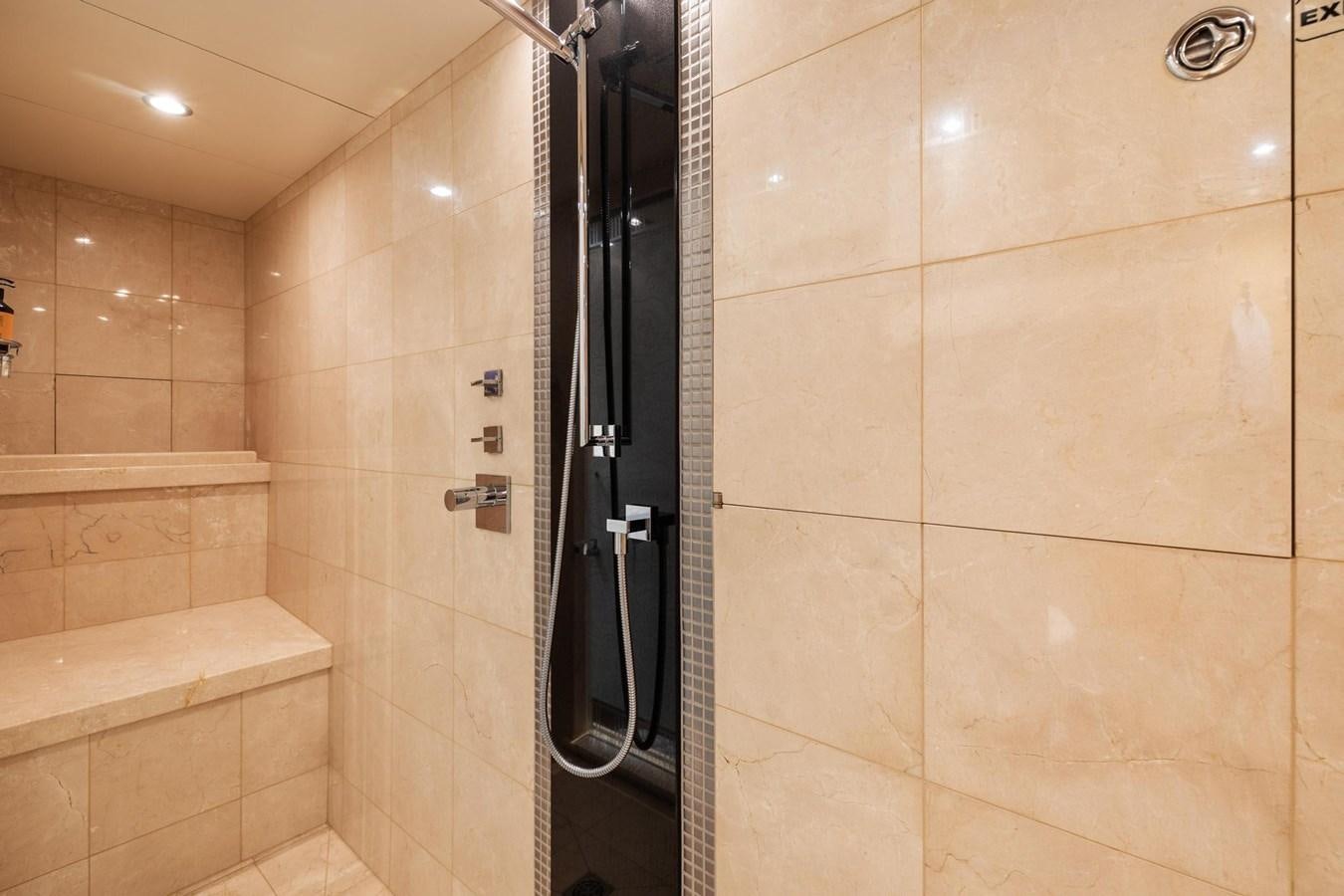 a bathroom with a shower unit aboard IZUMI Yacht for Sale