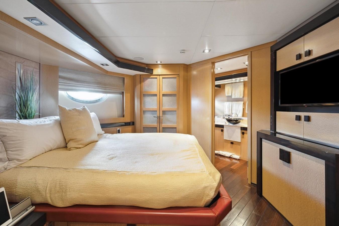 a bed in a room aboard IZUMI Yacht for Sale