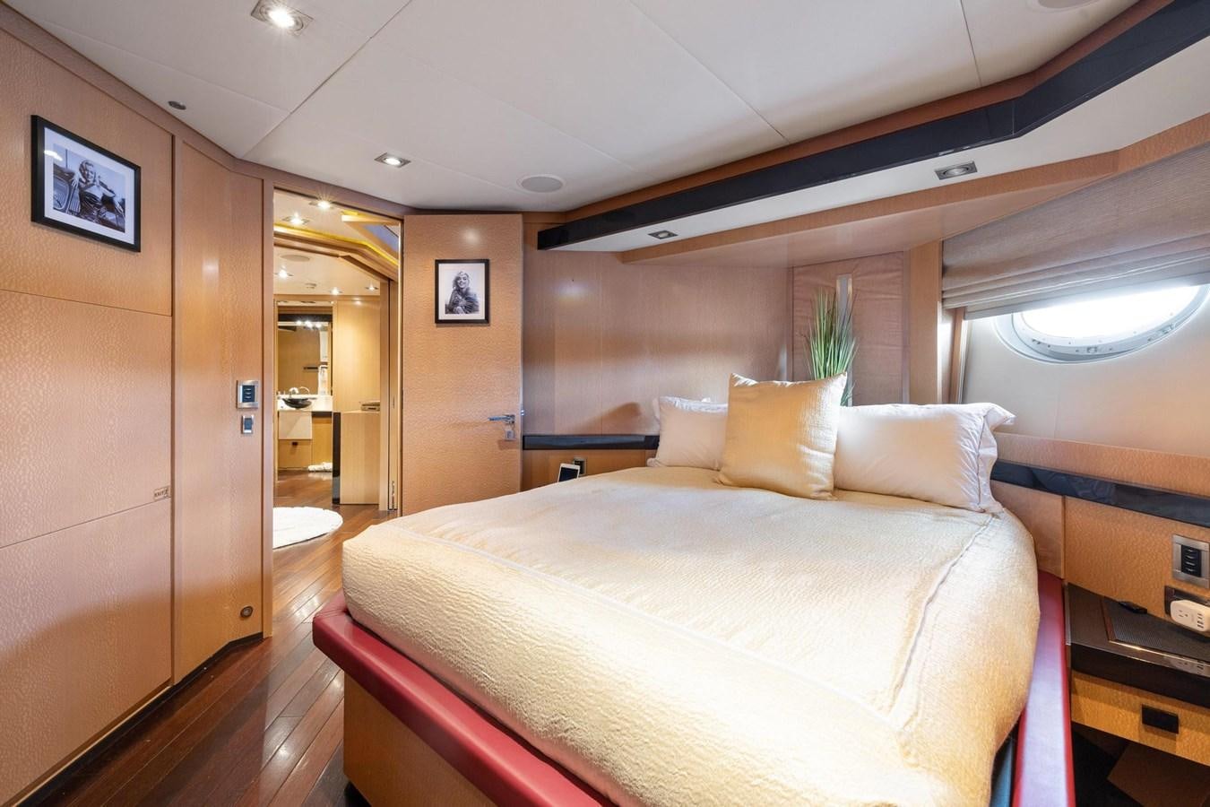 a bed in a room aboard IZUMI Yacht for Sale