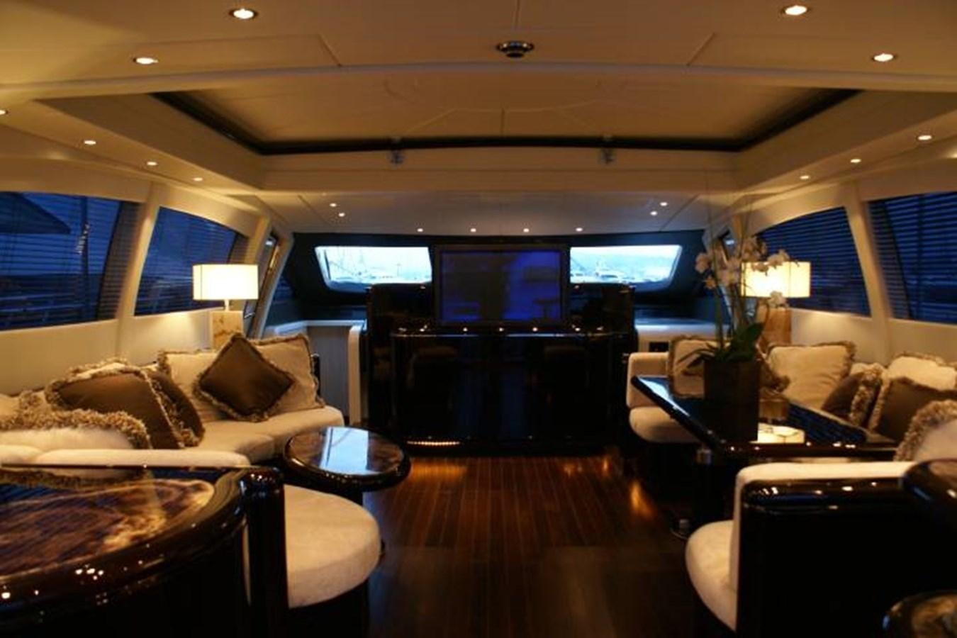 a room with a bed and a tv on the wall aboard ENZO Yacht for Sale