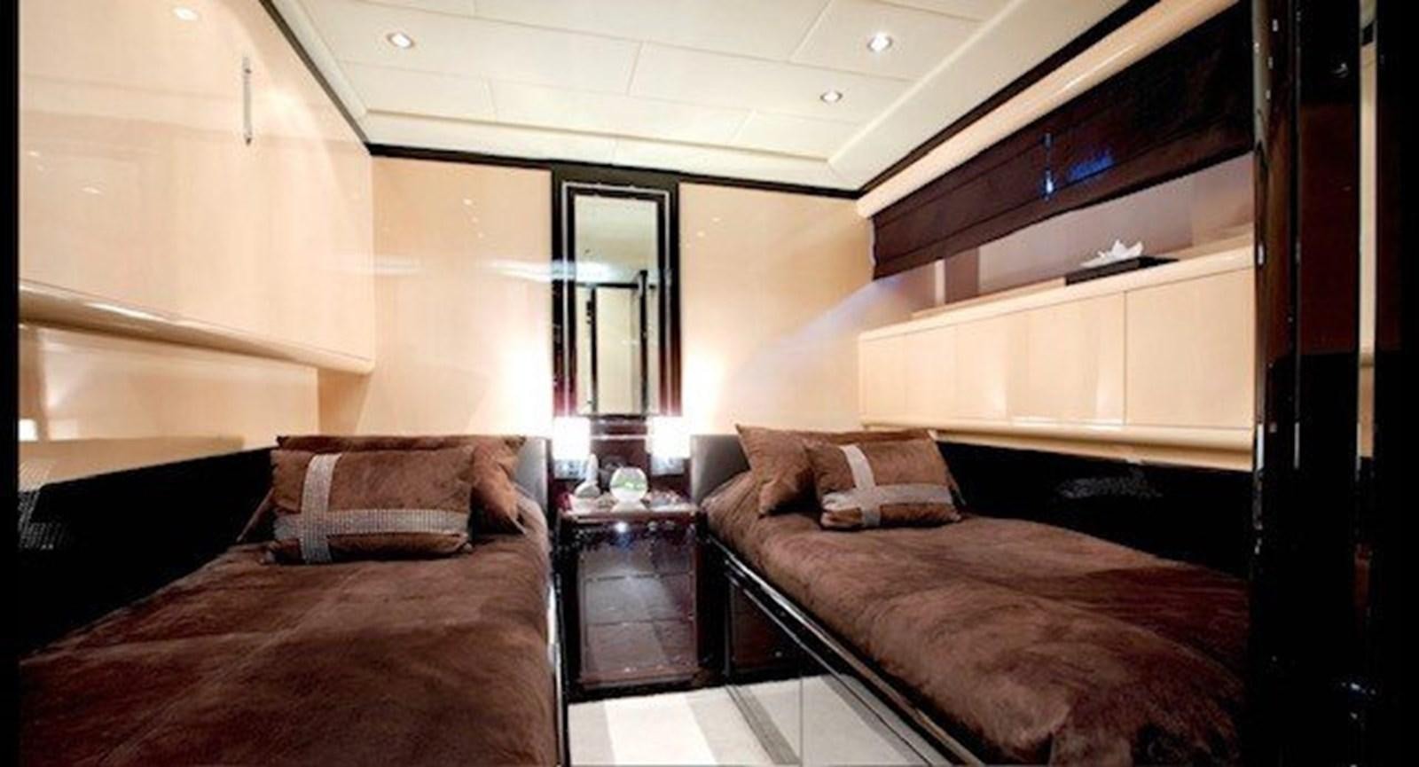 a room with two beds aboard ENZO Yacht for Sale