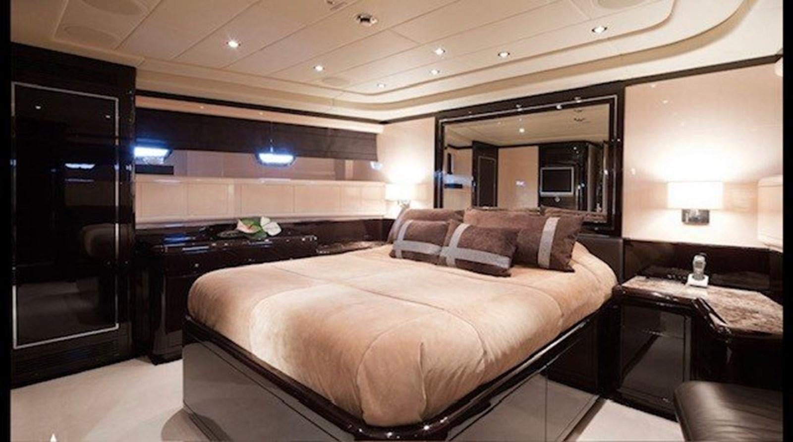 a bed in a room aboard ENZO Yacht for Sale