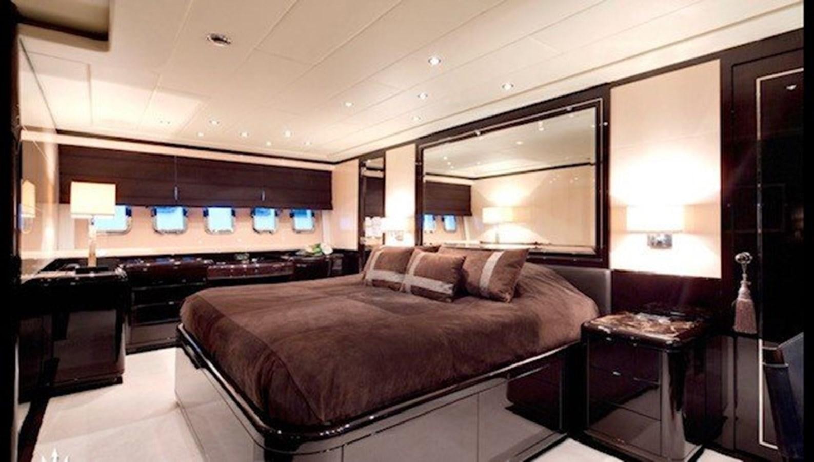 a large bed in a hotel room aboard ENZO Yacht for Sale
