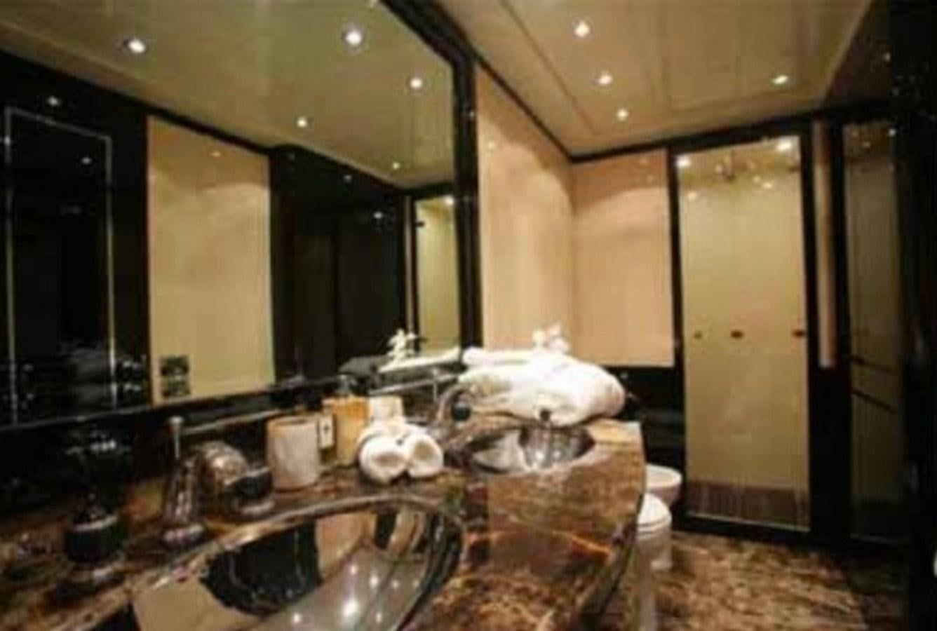 a bathroom with a large mirror aboard ENZO Yacht for Sale