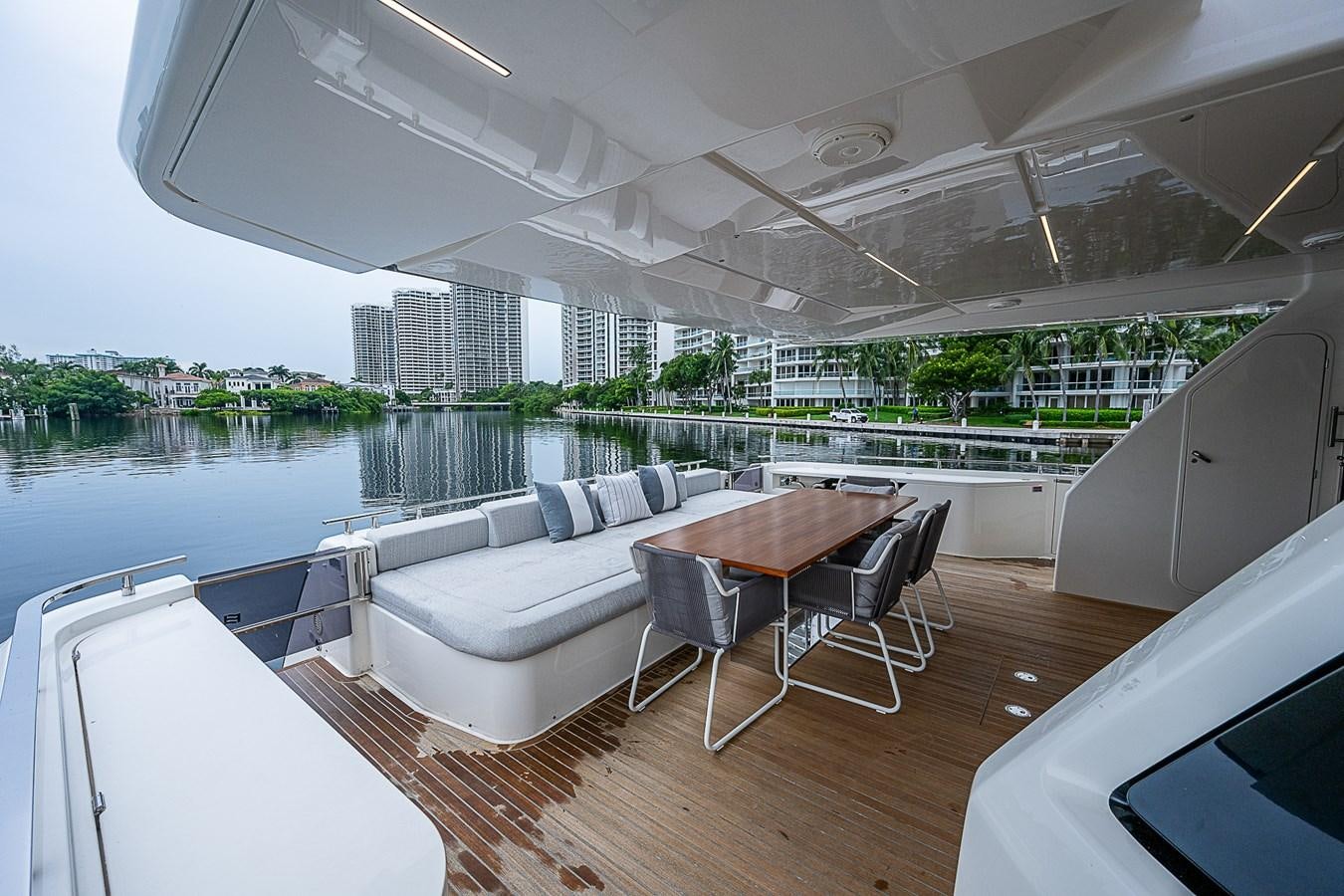 a room with a table chairs and a couch aboard DANDY 2021 FERRETTI 850 @ AVENTURA Yacht for Sale