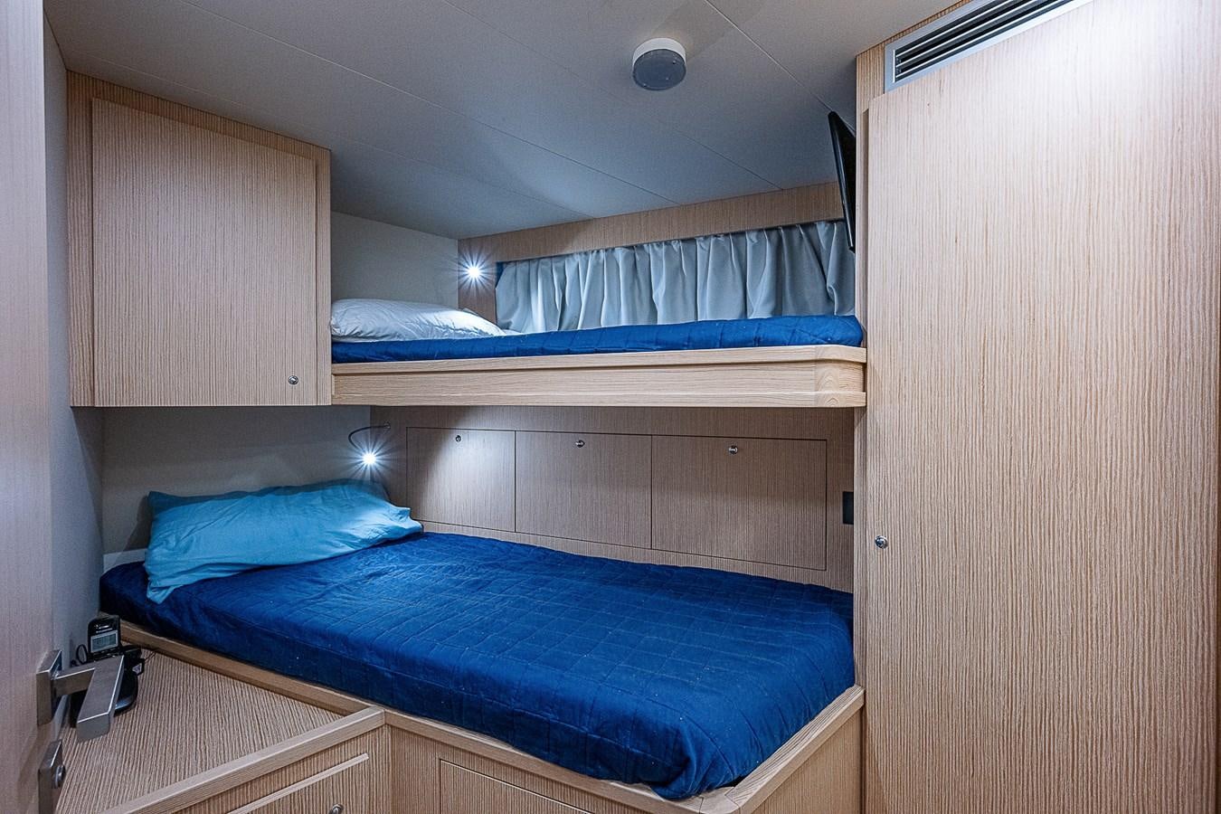a room with a bed and a wood cabinet aboard DANDY 2021 FERRETTI 850 @ AVENTURA Yacht for Sale