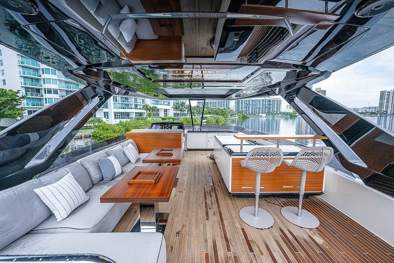 a room with a couch and a table and chairs aboard DANDY 2021 FERRETTI 850 @ AVENTURA Yacht for Sale