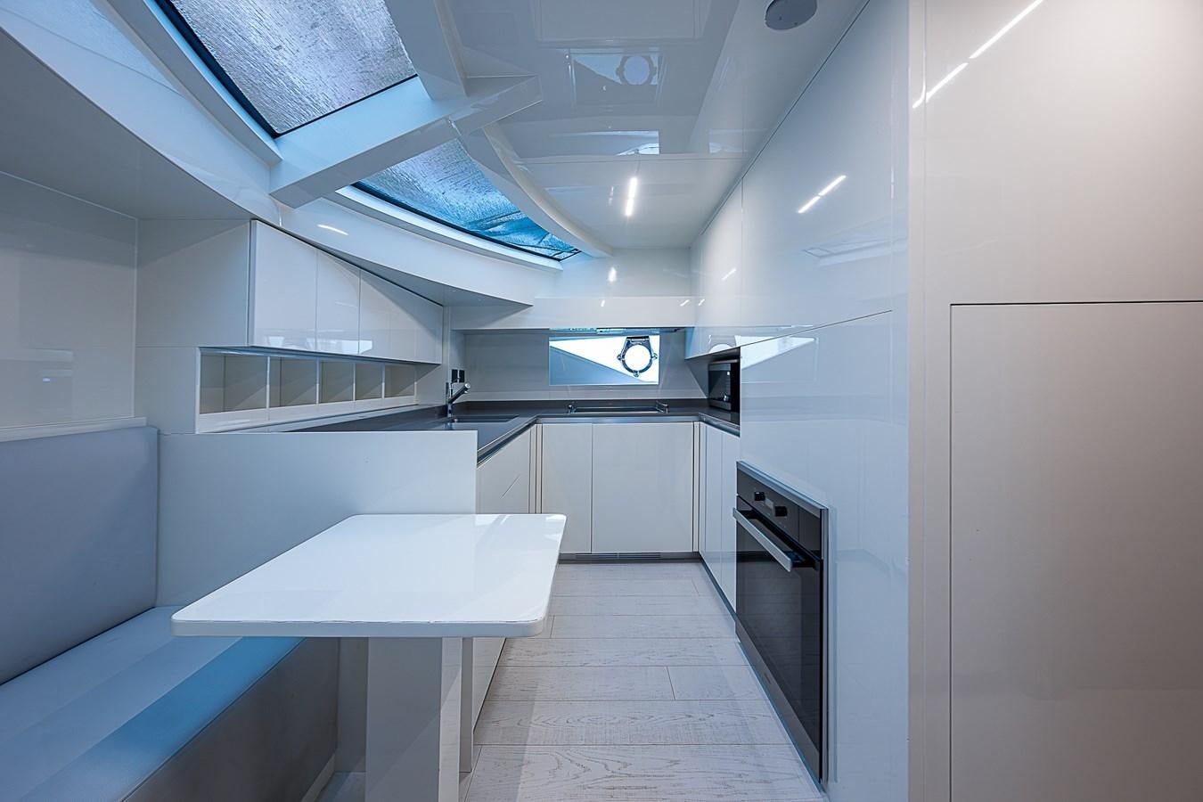 a room with a table and a couch aboard DANDY 2021 FERRETTI 850 @ AVENTURA Yacht for Sale