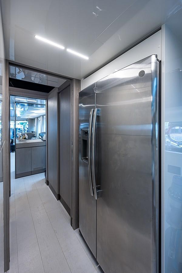 a large silver refrigerator in a kitchen aboard DANDY 2021 FERRETTI 850 @ AVENTURA Yacht for Sale
