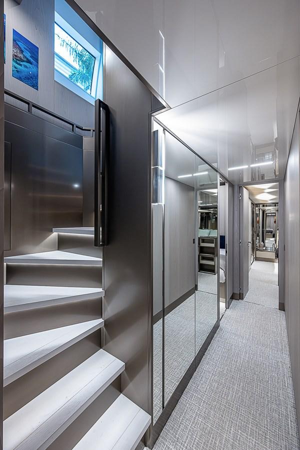 a hallway with a glass door aboard DANDY 2021 FERRETTI 850 @ AVENTURA Yacht for Sale