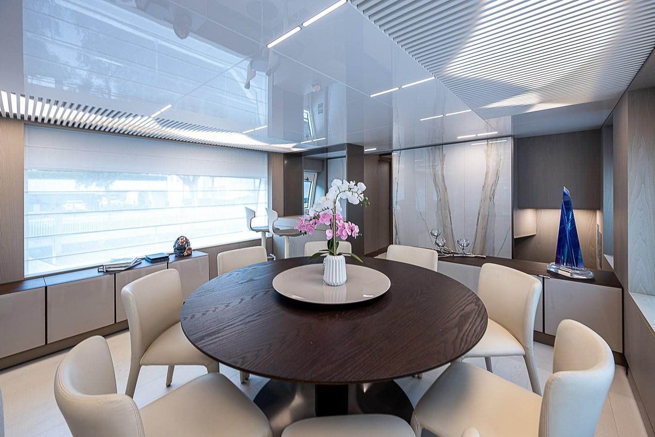 a room with a table and chairs aboard DANDY 2021 FERRETTI 850 @ AVENTURA Yacht for Sale