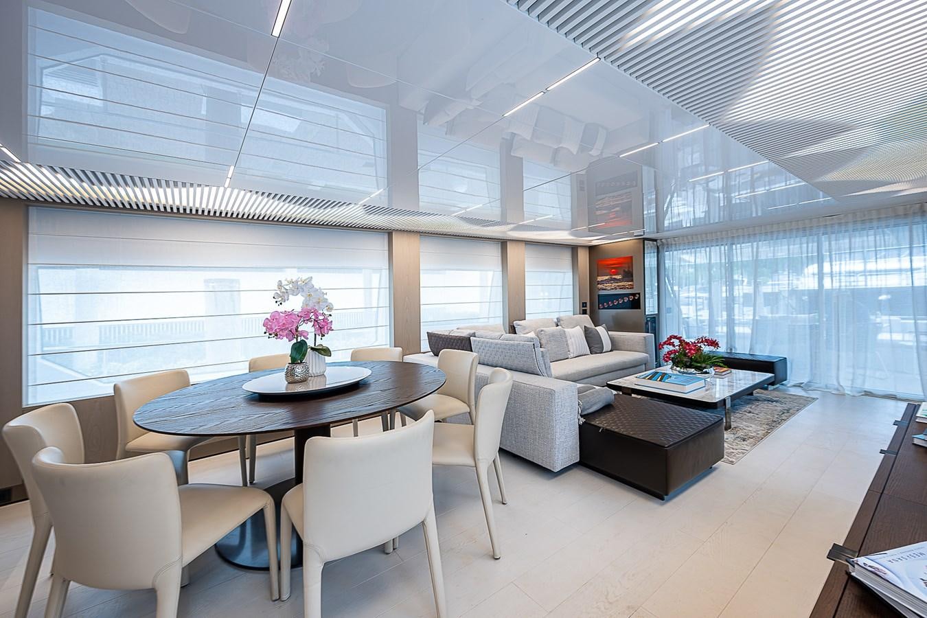 a room with a table and chairs aboard DANDY 2021 FERRETTI 850 @ AVENTURA Yacht for Sale