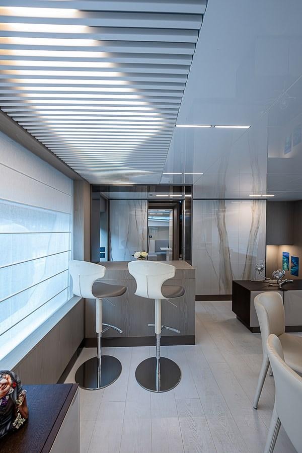 a room with a table and chairs aboard DANDY 2021 FERRETTI 850 @ AVENTURA Yacht for Sale