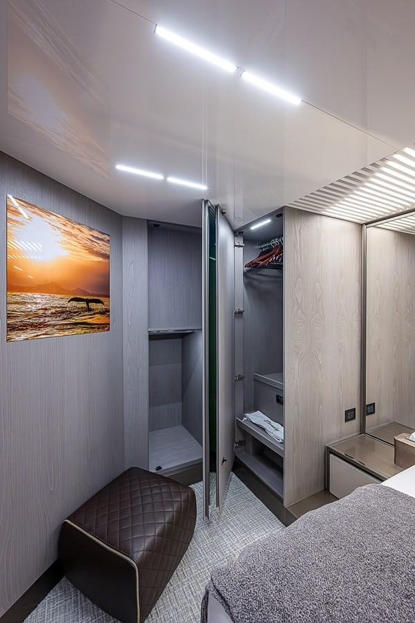 a room with a bed and a desk aboard DANDY 2021 FERRETTI 850 @ AVENTURA Yacht for Sale