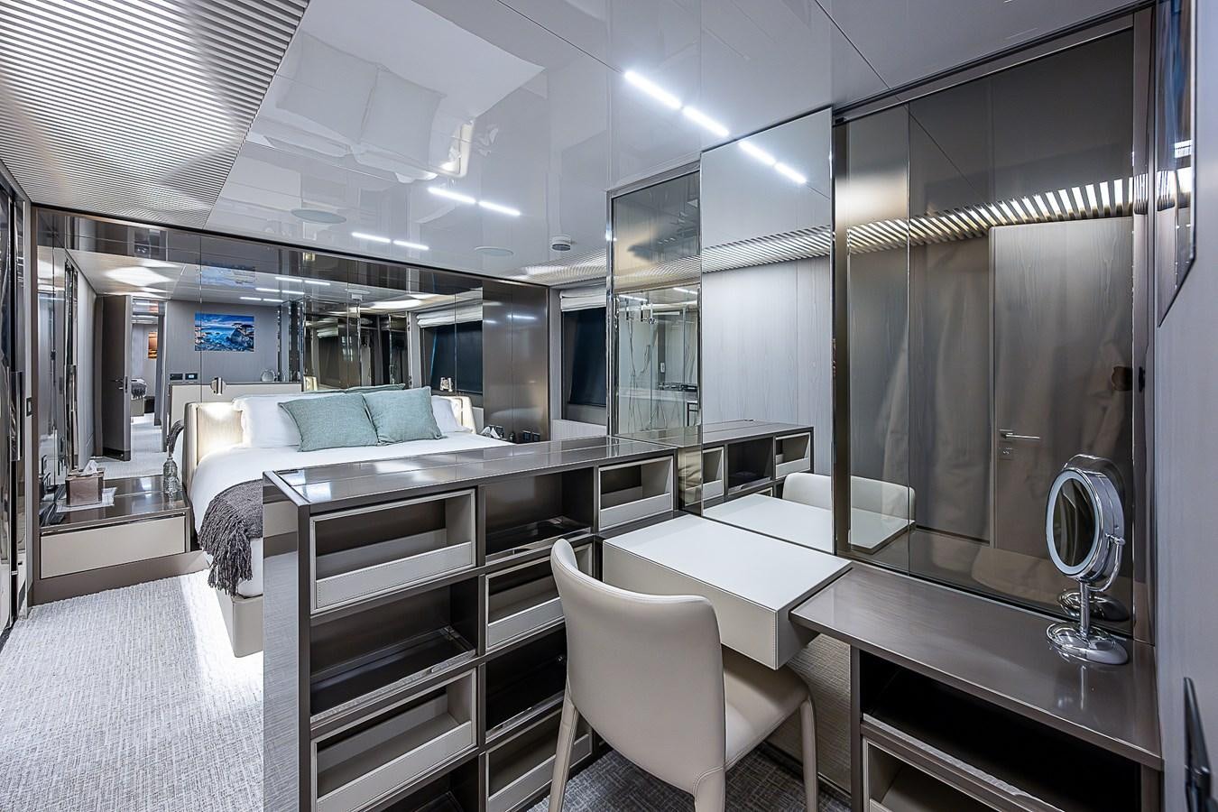 a room with a bed and a desk aboard DANDY 2021 FERRETTI 850 @ AVENTURA Yacht for Sale