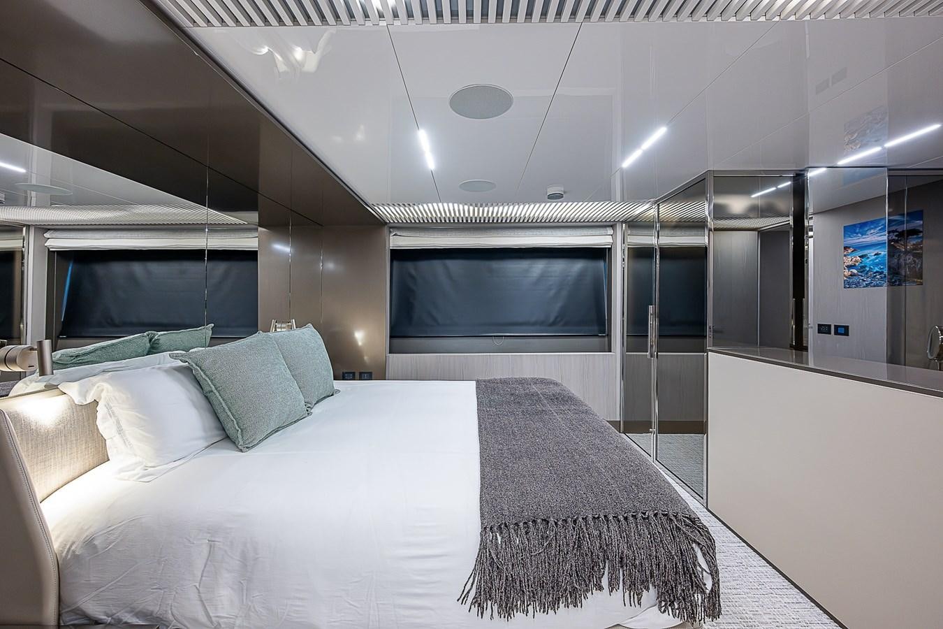 a bed in a room aboard DANDY 2021 FERRETTI 850 @ AVENTURA Yacht for Sale