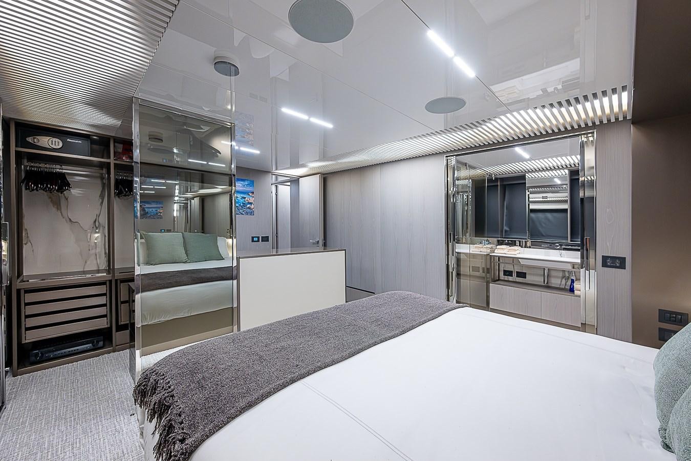 a room with a bed and a desk aboard DANDY 2021 FERRETTI 850 @ AVENTURA Yacht for Sale