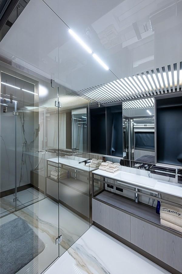 a bathroom with a large mirror aboard DANDY 2021 FERRETTI 850 @ AVENTURA Yacht for Sale