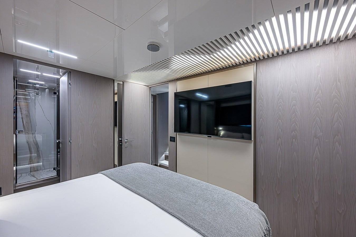 a room with a bed and a window aboard DANDY 2021 FERRETTI 850 @ AVENTURA Yacht for Sale