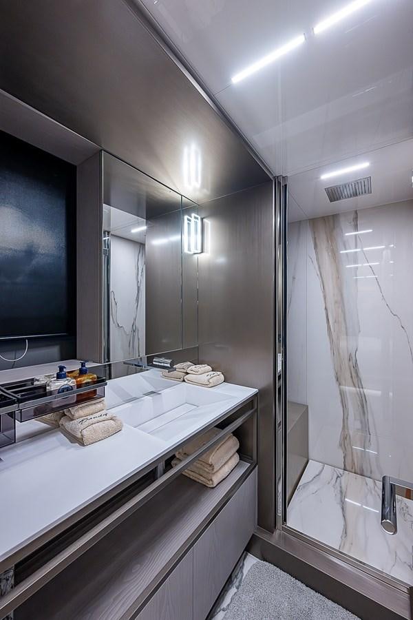 a bathroom with a large mirror aboard DANDY 2021 FERRETTI 850 @ AVENTURA Yacht for Sale