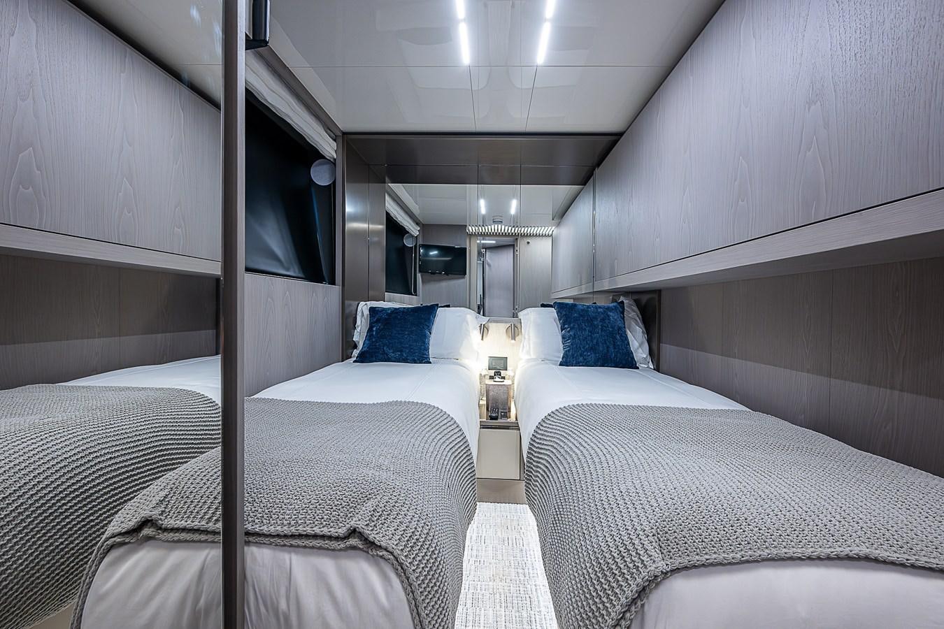 a room with beds and a window aboard DANDY 2021 FERRETTI 850 @ AVENTURA Yacht for Sale