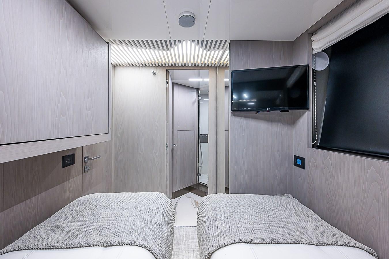 a room with a bed and a television aboard DANDY 2021 FERRETTI 850 @ AVENTURA Yacht for Sale