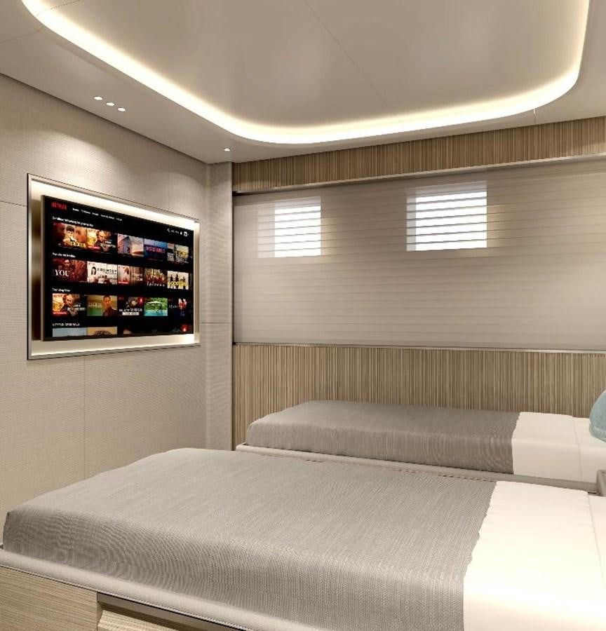 a bed with a tv on the wall aboard VIRTUS 47M NB 115 Yacht for Sale