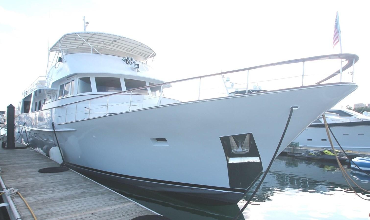 a boat docked at a pier aboard ENCHANTRESS Yacht for Sale