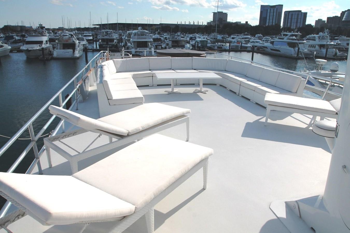 a room with a view of a city and boats aboard ENCHANTRESS Yacht for Sale
