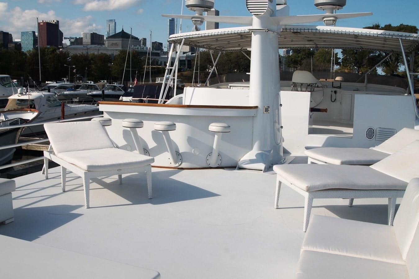 a group of white tables outside aboard ENCHANTRESS Yacht for Sale