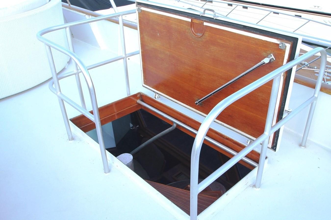 a wooden chair on a white surface aboard ENCHANTRESS Yacht for Sale