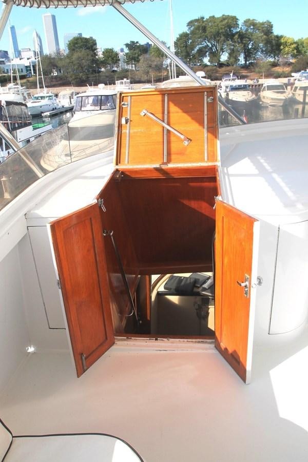 a wooden boat on a deck aboard ENCHANTRESS Yacht for Sale