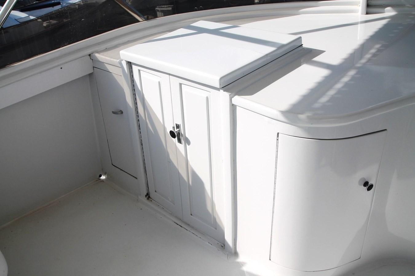 a row of white cabinets aboard ENCHANTRESS Yacht for Sale