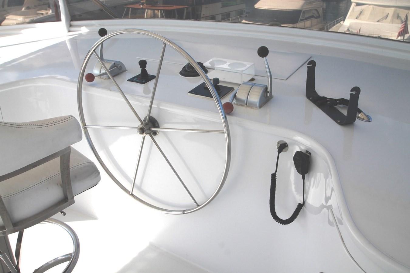 a white car with a steering wheel aboard ENCHANTRESS Yacht for Sale