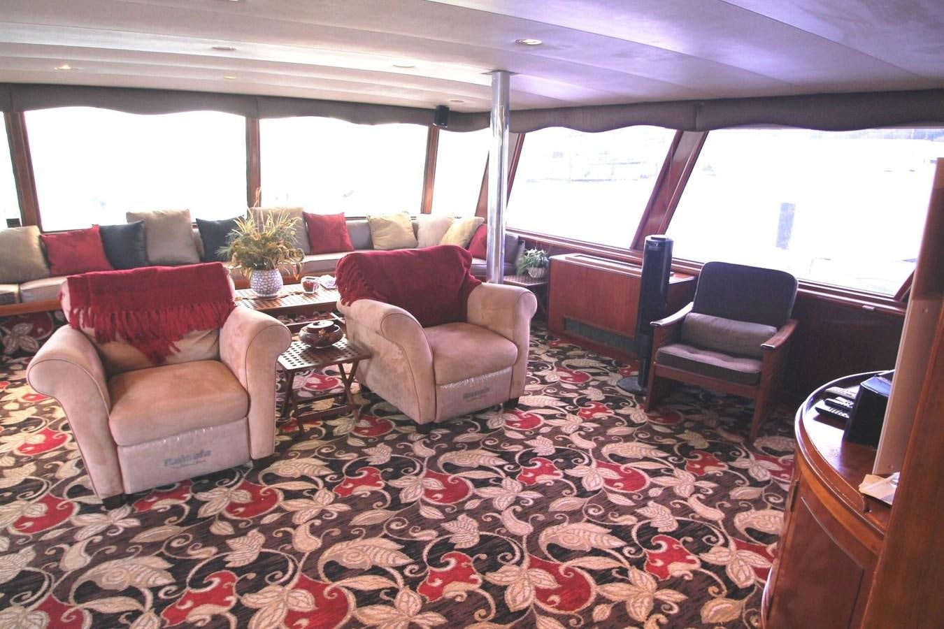 a living room with a couch and chairs aboard ENCHANTRESS Yacht for Sale