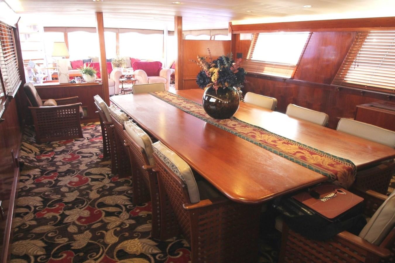 a dining room with a table and chairs aboard ENCHANTRESS Yacht for Sale