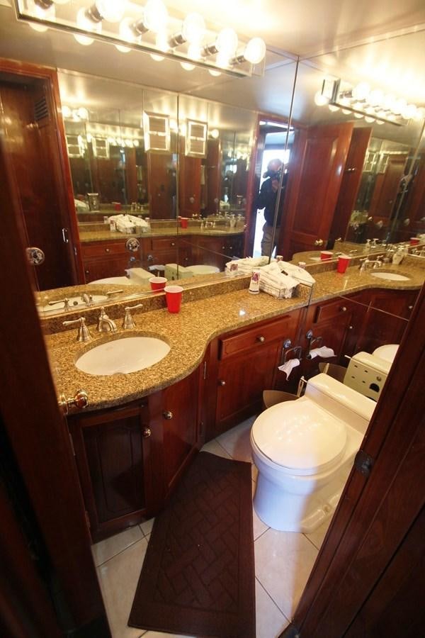 a bathroom with a large mirror aboard ENCHANTRESS Yacht for Sale
