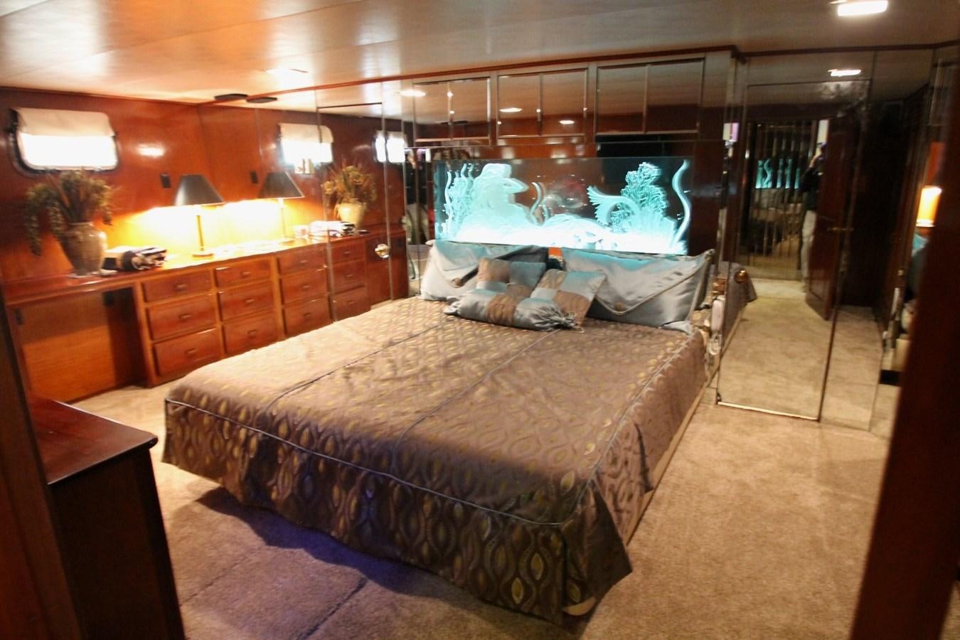 a bed in a room aboard ENCHANTRESS Yacht for Sale