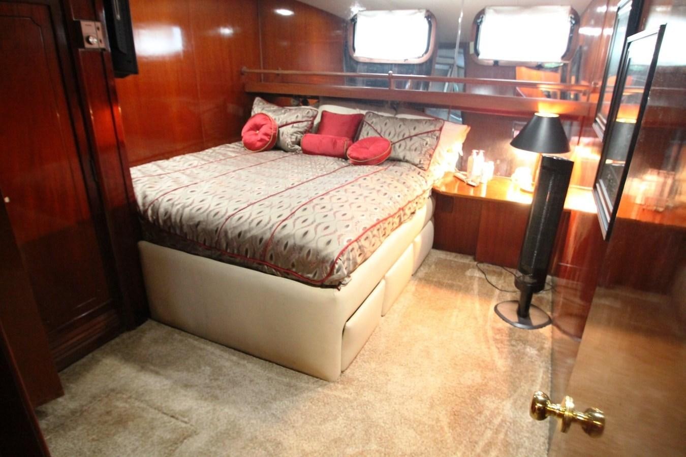 a bed in a room aboard ENCHANTRESS Yacht for Sale