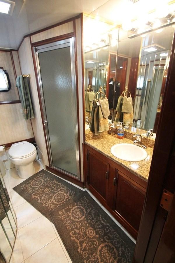 a bathroom with a sink and a toilet aboard ENCHANTRESS Yacht for Sale