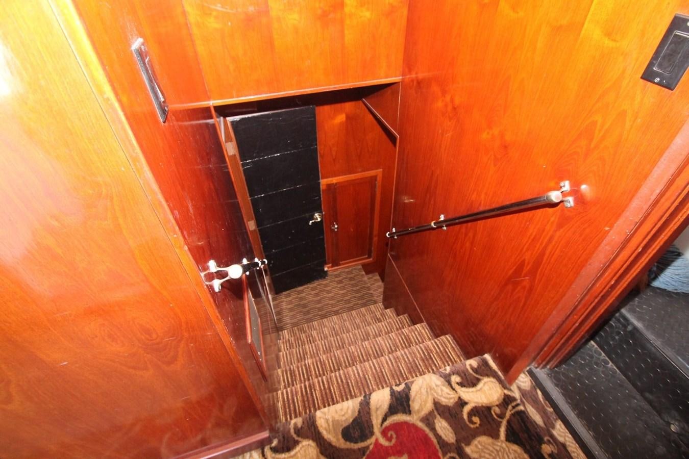 a wooden door with a rug aboard ENCHANTRESS Yacht for Sale