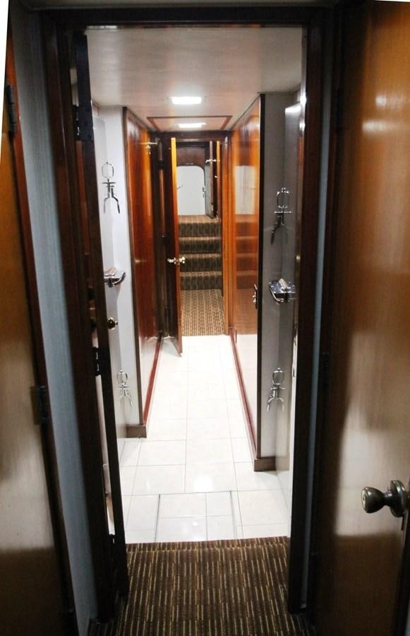 a hallway with doors aboard ENCHANTRESS Yacht for Sale