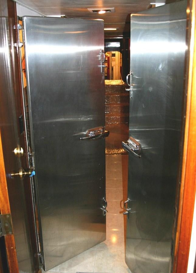 a couple of black doors aboard ENCHANTRESS Yacht for Sale