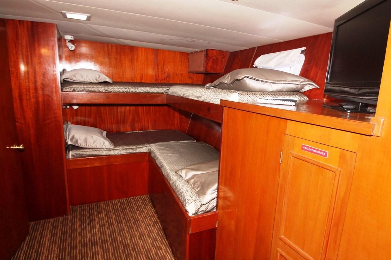 a room with bunk beds aboard ENCHANTRESS Yacht for Sale