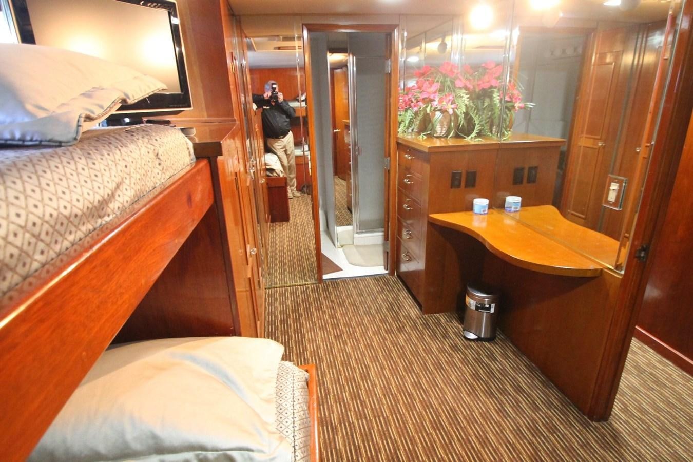 a room with a desk and a bed aboard ENCHANTRESS Yacht for Sale