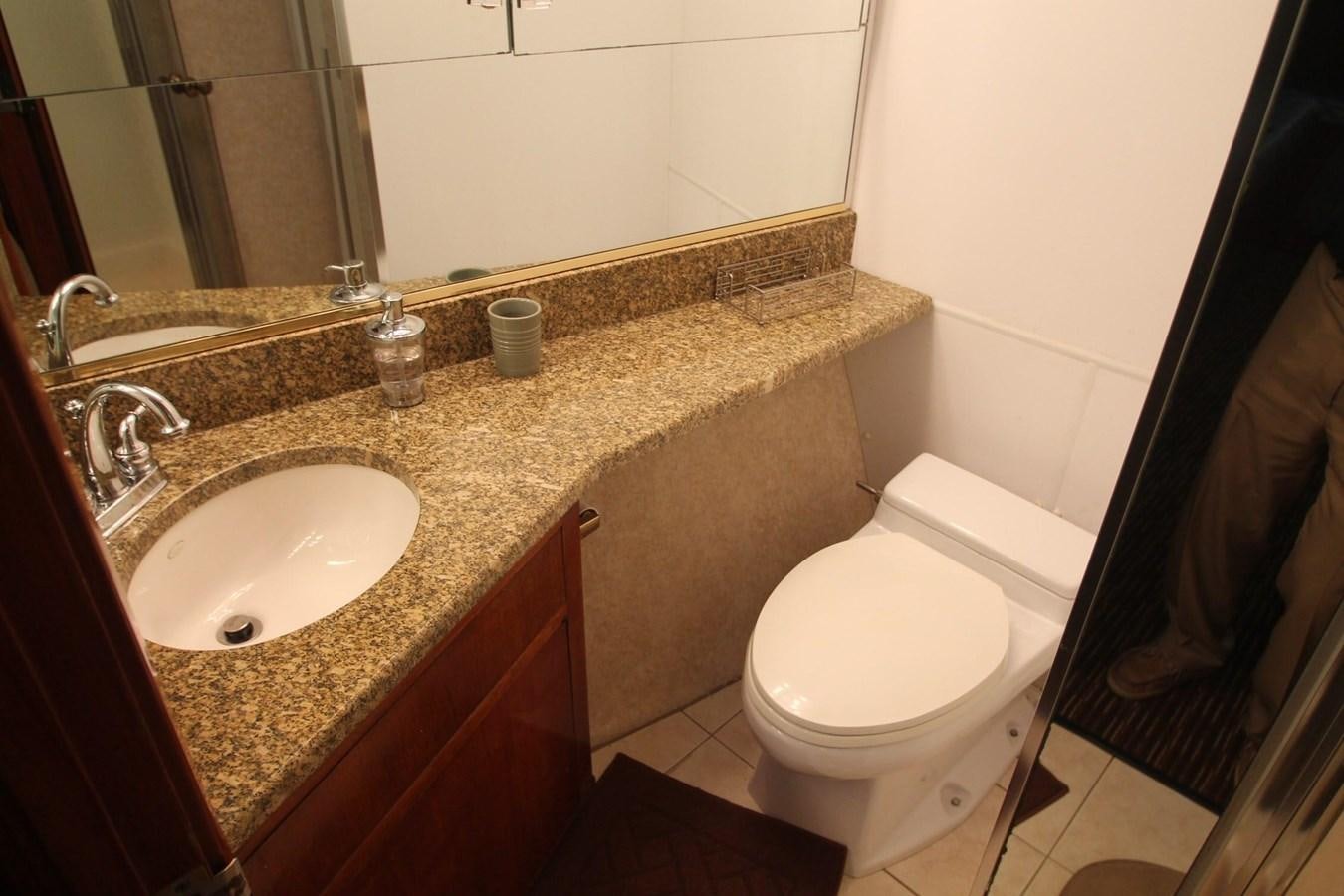 a bathroom with a marble counter top aboard ENCHANTRESS Yacht for Sale
