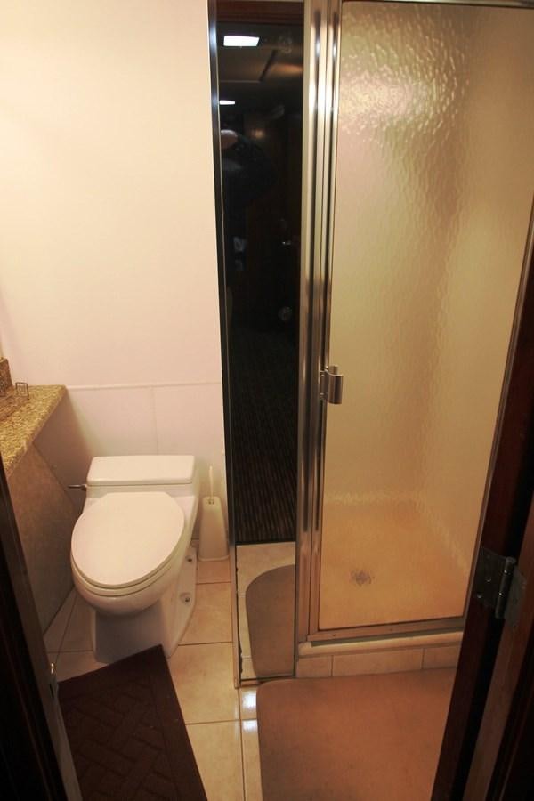 a bathroom with a stand up shower aboard ENCHANTRESS Yacht for Sale